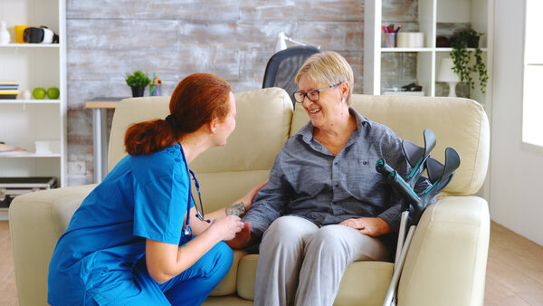female-nurse-talking-with-old-woman-with-alzheimer-nursing-home female-nurse-talking-with-old-woman-with-alzheimer-nursing-home